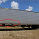 Image Credit: NTSB. Right side of semitrailer. Area in red oval highlights collision damage from passenger car.